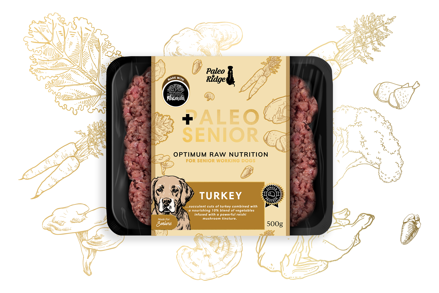 A plastic tray containing 500g of raw minced dog food is labeled Paleo Ridge Paleo Senior Turkey, formulated for senior working dogs. The beige label, featuring a dog illustration, highlights natural ingredients and quality nutrition specifically for older dogs. Background sketches of vegetables and reishi mushrooms emphasize the wholesome goodness ideal for your dog’s golden years.
